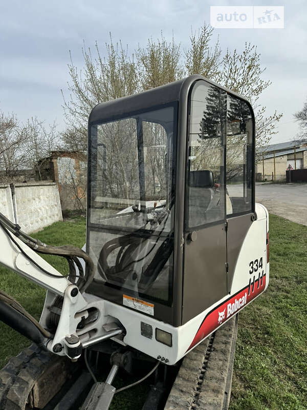 Экскаватор погрузчик Bobcat 334 2003 в Каменец-Подольском