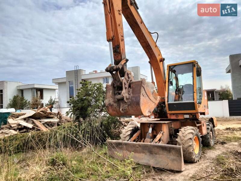 Экскаватор погрузчик Case Construction 695 ST 1994 в 