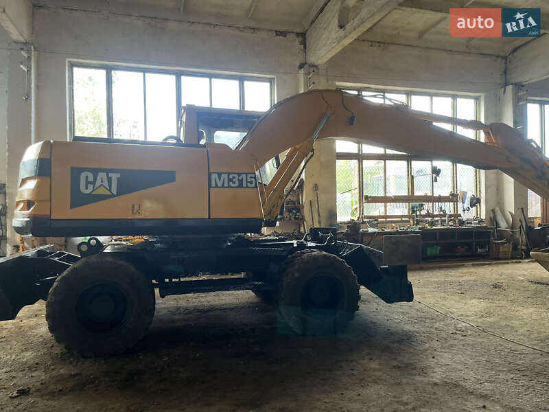 Колесный экскаватор Caterpillar 315 2001 в Косове