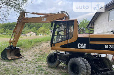 Экскаватор погрузчик Caterpillar 318 2000 в Тячеве