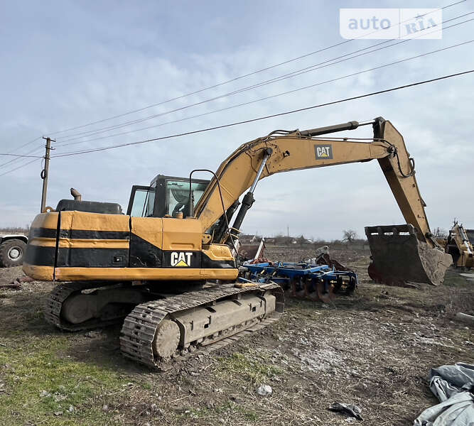 Экскаватор погрузчик Caterpillar 320 1998 в Запорожье