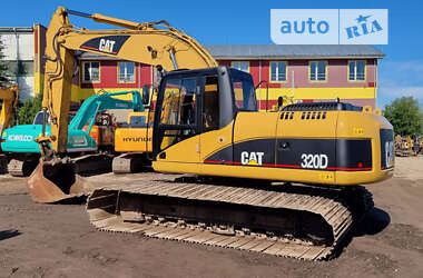 Гусеничный экскаватор Caterpillar 320 2009 в 