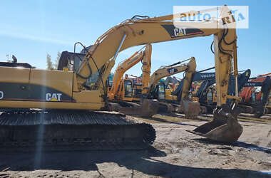 Гусеничный экскаватор Caterpillar 320 2009 в 