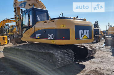 Гусеничный экскаватор Caterpillar 320 2009 в 
