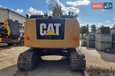 Гусеничный экскаватор Caterpillar 320 2013 в 