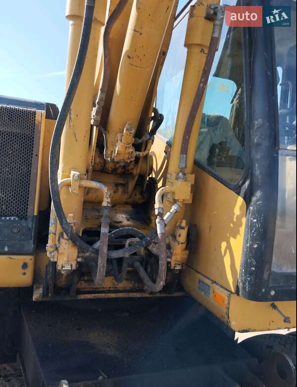 Екскаватор навантажувач Caterpillar M312 2002 в Житомирі