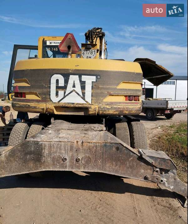 Екскаватор навантажувач Caterpillar M312 2002 в Житомирі