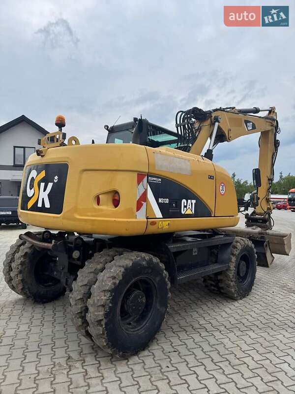 Колесный экскаватор Caterpillar M313 2012 в Долине