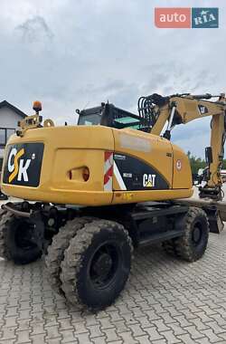 Колесный экскаватор Caterpillar M313 2012 в 