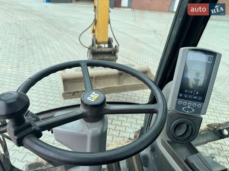 Колесный экскаватор Caterpillar M313 2012 в Долине
