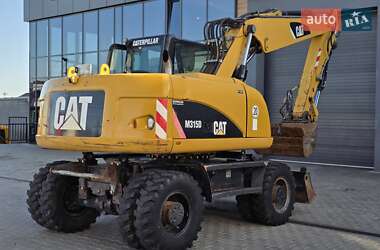 Колесный экскаватор Caterpillar M315 2009 в 