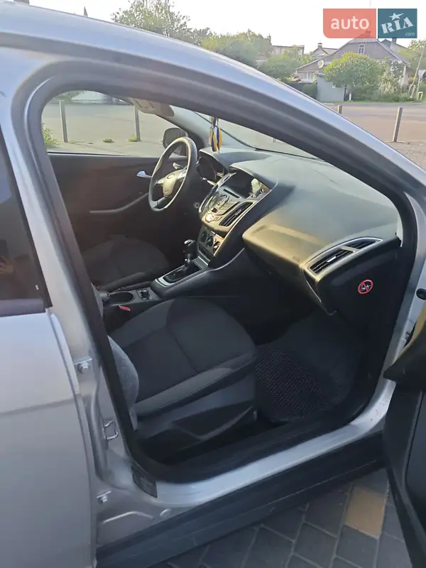 Ford Focus 2013 VIN WF0LXXGCBLDM18303 фото оголошення 8 з 56