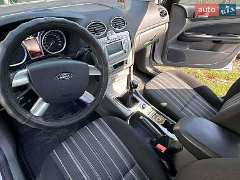 2010 Ford Focus, VIN WF0SXXGCDSAA63439:plate — фото 1 (autoria)