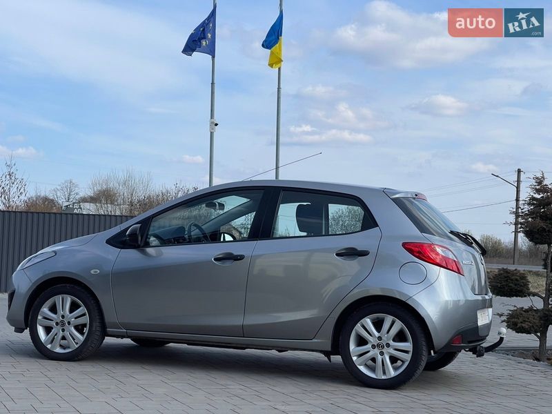 2012 Mazda 2, VIN JMZDEA4K210455648:plate — фото 1 (autoria)
