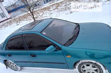 Седан Mazda 323 1996 в 