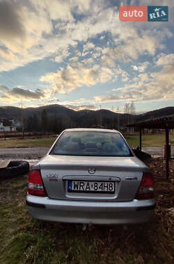 Седан Mazda 323 2000 в 
