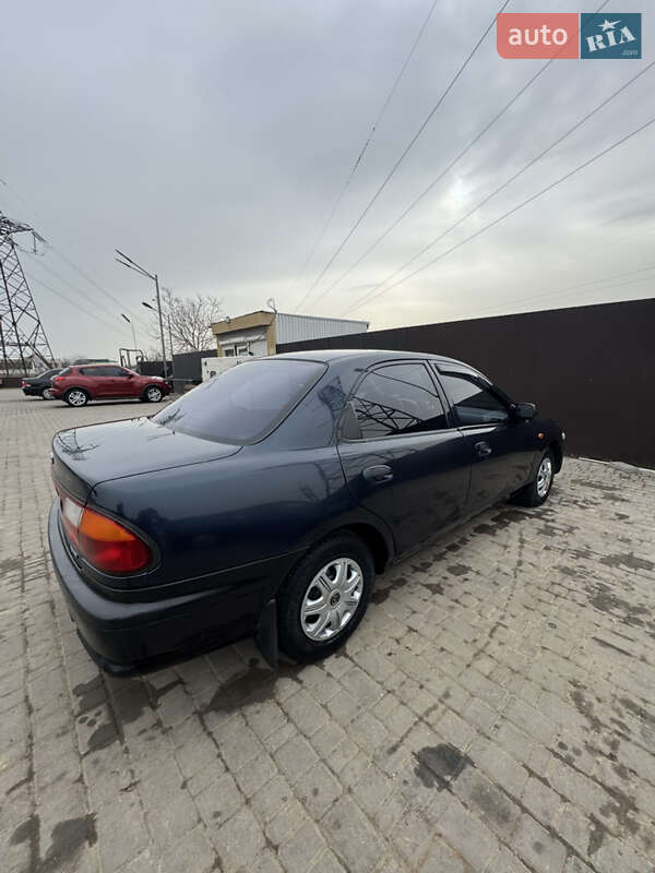 Седан Mazda 323 1997 в Одессе фото 5 Седан Mazda 323 1997 в Одессе