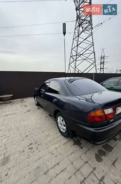 Седан Mazda 323 1997 в 