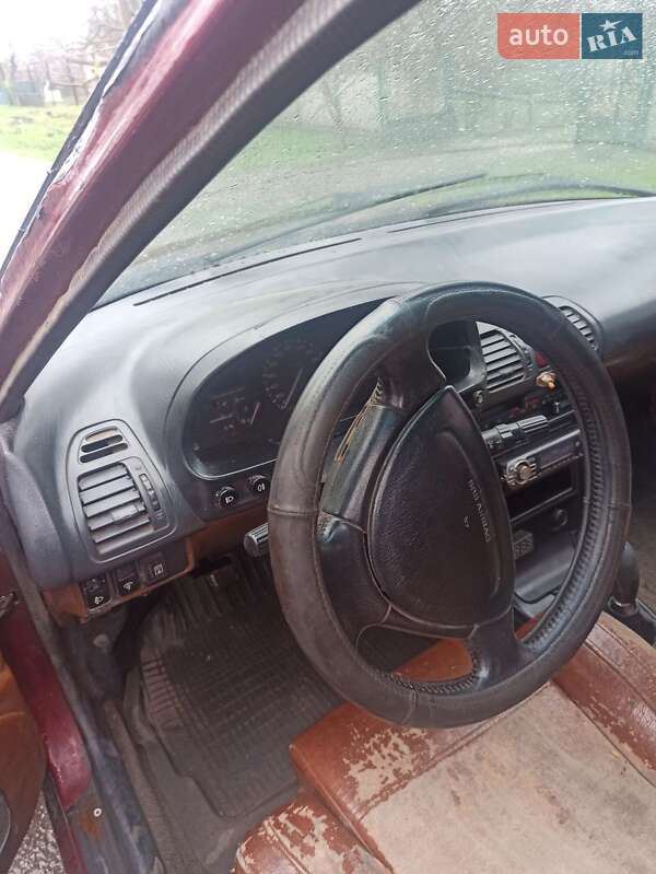 Хетчбек Mazda 323 1993 в Чумаках фото 7 Хетчбек Mazda 323 1993 в Чумаках