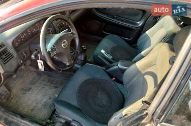 Хэтчбек Mazda 323 1998 в 