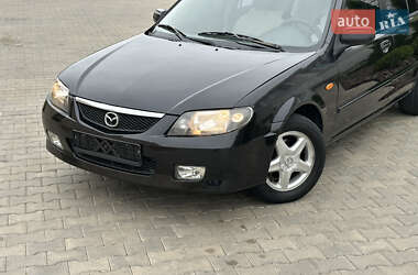Хэтчбек Mazda 323 2003 в 