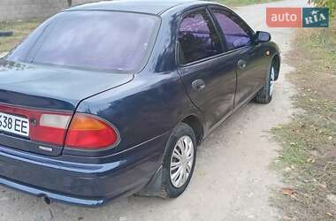 Седан Mazda 323 1998 в  фото 4 Седан Mazda 323 1998 в