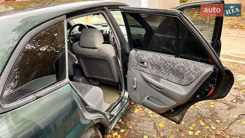 Хетчбек Mazda 323 1999 в Києві фото 9 Хетчбек Mazda 323 1999 в Києві