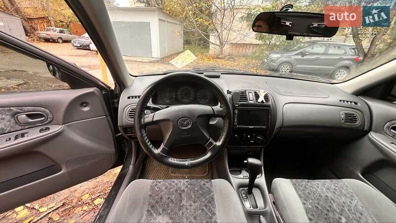 Хетчбек Mazda 323 1999 в Києві фото 14 Хетчбек Mazda 323 1999 в Києві