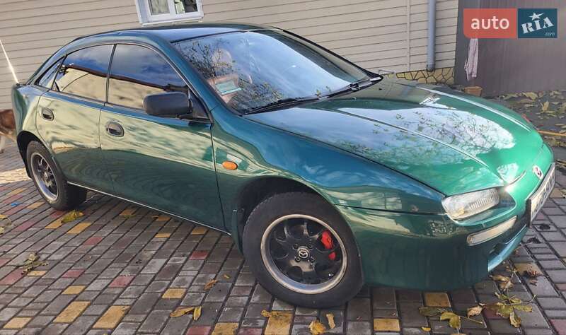 Хетчбек Mazda 323 1998 в Подільську фото 6 Хетчбек Mazda 323 1998 в Подільську
