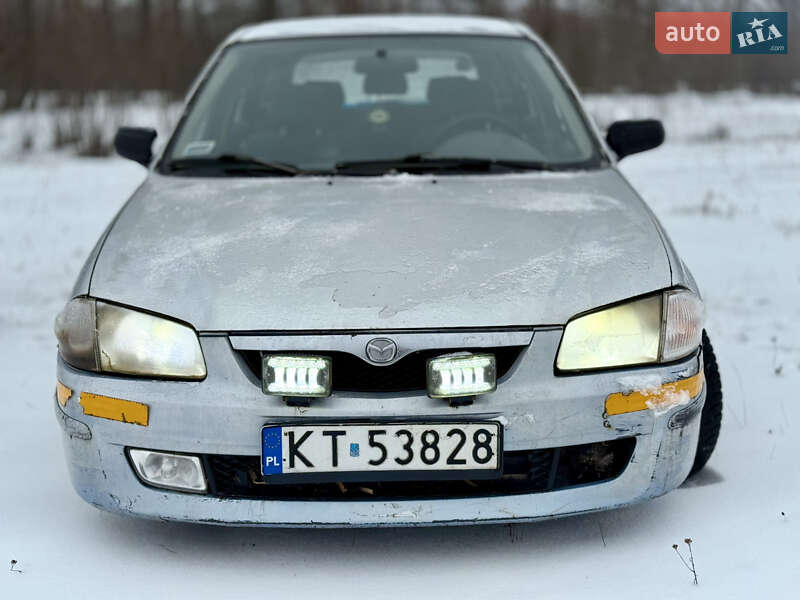 Хэтчбек Mazda 323 1999 в Калиновке фото 12 Хэтчбек Mazda 323 1999 в Калиновке