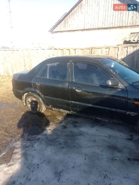 Седан Mazda 323 2002 в Ріпках