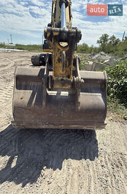 Екскаватор навантажувач New Holland E 305 2013 в 