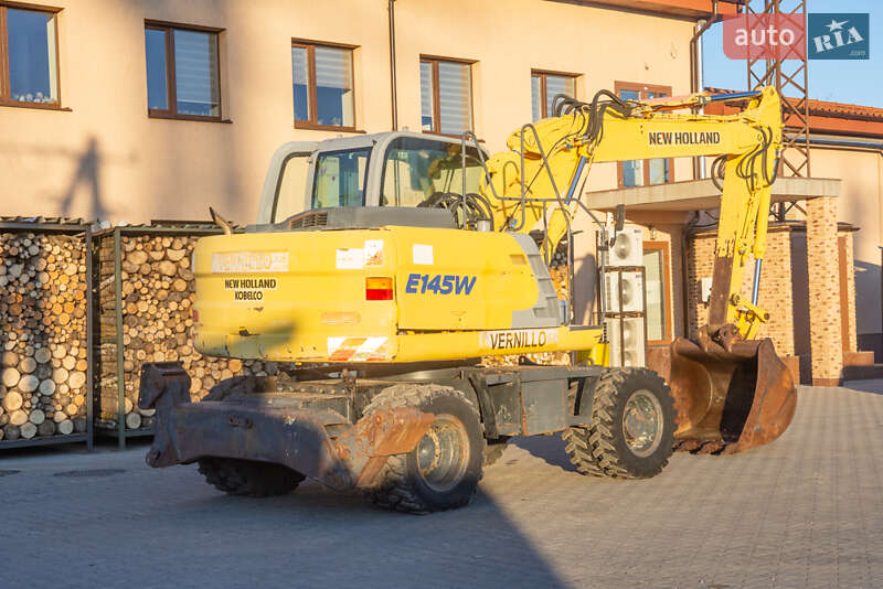Колесный экскаватор New Holland MH 3.6 2003 в 