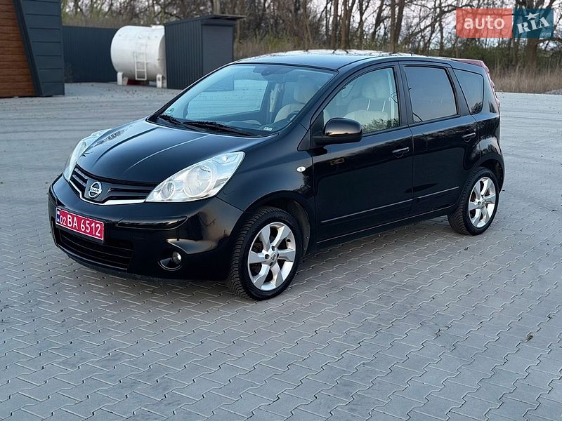 2010 Nissan Note, VIN SJNFAAE11U2075583:plate — фото 1 (autoria)