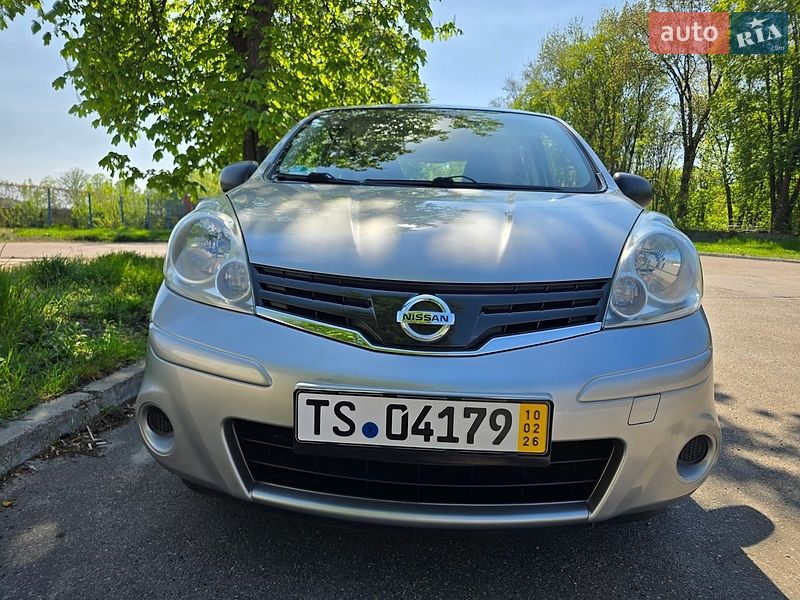 2011 Nissan Note, VIN SJNFAAE11U2077553:plate — фото 1 (autoria)