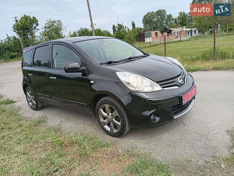 2011 Nissan Note, VIN SJNFAAE11U2103483:plate — фото 1 (autoria)