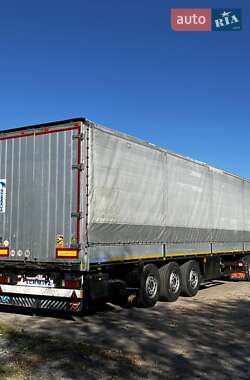 Бортовой полуприцеп Schmitz Cargobull S01 2001 в Мене