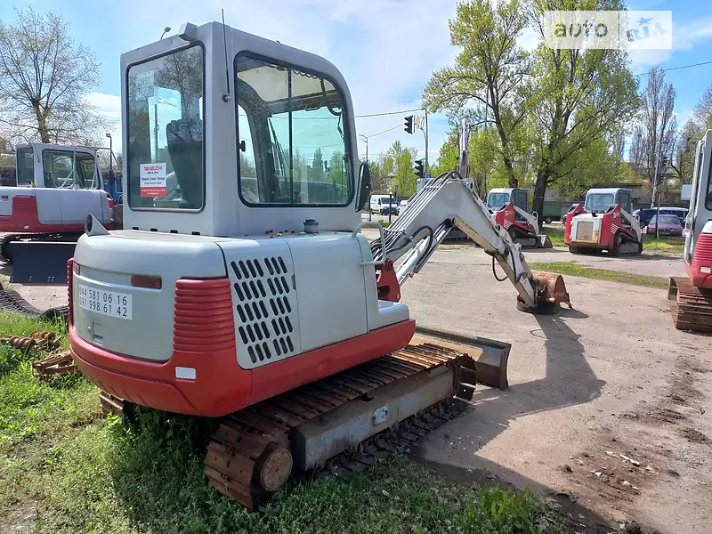 Экскаватор погрузчик Takeuchi TB 2008 в 