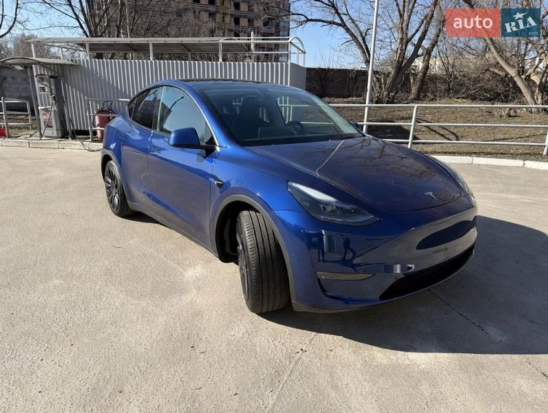 2023 Tesla Model Y, VIN 7SAYGAEE5PF701866:plate — фото 1 (autoria)