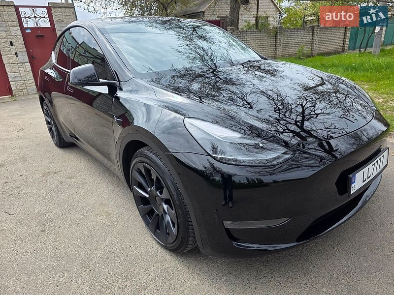 2023 Tesla Model Y, VIN 7SAYGAEE2PF749860:plate — фото 1 (autoria)